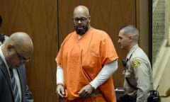 Marion "Suge" Knight is escorted into court for his arraignment on murder charges.