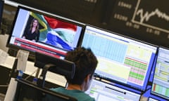 A stock trader on the Frankfurt Stock Exchange in Germany today.