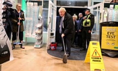 Britain’s PM Johnson visits Matlock, Derbyshire, to view the flooding<br>Britain’s Prime Minister Boris Johnson mops the floor to help with the clean-up at an opticians during a visit to the flood-hit town of Matlock, Derbyshire, Britain November 8, 2019. Picture taken November 8, 2019. Danny Lawson/Pool via REUTERS
