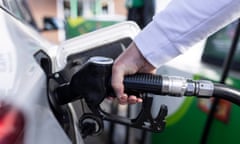 A customer fills his car with diesel at at a garage