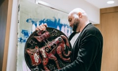 Leonid Marushchak with an art work by Ukrainian ceramicist Nina Fedorova, from his personal collection.