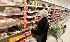 An older woman shopping in a supermarket