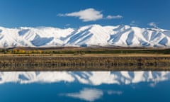 The Ben Ohau mountain range rises above Lake Pukaki and the Pukaki Canal near Twizel in the heart of the Mackenzie district of New Zealand’s South Island.