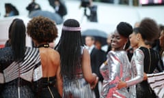 Aïssa Maïga (facing camera) joins a red-carpet protest of BME female actors, against racism in French film.