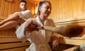 A couple enjoying time in a sauna