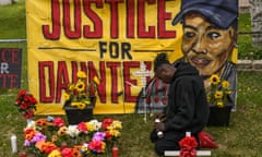 Antwon Davis lights candles at a memorial for Daunte Wright in Brooklyn Center, Minnesota. 