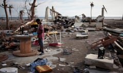 A boy plays in a building destroyed by hurricane Matthew in Coteaux, Haiti.