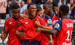 Lille forward Lebo Mothiba (C) celebrates with teammates after scoring against Rennes.