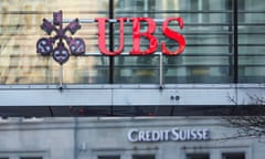 Logos of Swiss banks UBS and Credit Suisse are seen in Zurich