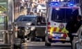 Australian police stand near a crashed vehicle after they arrested the driver of a vehicle that had ploughed into pedestrians at a crowded intersection near the Flinders Street train station in central Melbourne, Australia December 21, 2017.  REUTERS/Luis Ascui TPX IMAGES OF THE DAY