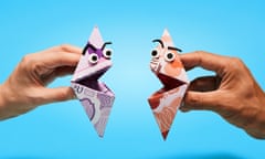 Two folded origami faces made from £10 and £20 notes