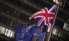 UK and EU flags outside a building