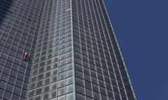 Alain Robert climbs the Tour Total skyscraper in Paris on Saturday.