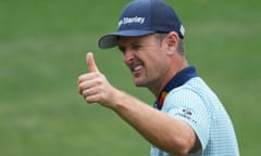Justin Rose gives a thumbs up after putting on the 18th for a 72