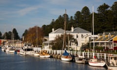 A line of boats and historic houses in Port Fairy