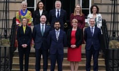 The members of the SNP cabinet pose for a group photograph on the steps of Bute House