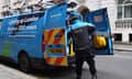 A British Gas worker gathers equipment from his van in Westminster, London