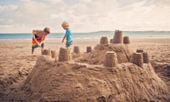 Boys building sandcastles on a beach