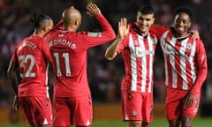 Mohamed Elyounoussi (second right) celebrates with Southampton teammates