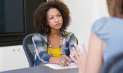 African American woman taking an interview of a woman