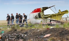 Final report on downing of MH17 to be released<br>epa04975644 (FILE) Armed rebel soldiers pass a big piece of debris at the main crash site of the Boeing 777 Malaysia Airlines flight MH17, which crashed during flying over the eastern Ukraine region, near Grabovo, some 100 km east of Donetsk, Ukraine, 20 July 2014. The Dutch Safety Board, on 13 October 2015, will report the results of its investigation into the downing of Malaysia Airlines flight MH17 over Ukraine which killed all 298 people on board. The report is to answer whether the Boeing jet was struck by a Russia-made ground-to-air Buk missile. The aeroplane was en route from Amsterdam to Kuala Lumpur at the time of the July 17, 2014, crash. The Netherlands has taken the lead in the investigation, since most of the dead were Dutch nationals.  EPA/ROBERT GHEMENT