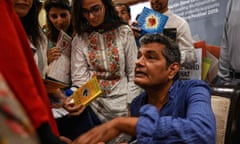 Mohammed Hanif gives autographs at an Islamabad literature festival in September 2019, after A Case of Exploding Mangoes was finally released in Urdu.