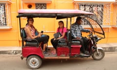 Sheela Banerjee, left, back in Chandannagar, West Bengal, and on a Toto ride with her daughter