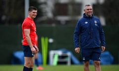 Jason Ryles works with England back Owen Farrell during training