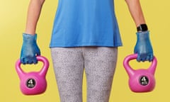 Zoe Williams holding wearing surgical gloves and holding pink dumbbells