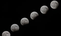 A multiple exposure photograph shows the moon in various stages of  eclipse during the partial lunar eclipse of 7 August 2017.