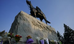 Flowers are placed on a statue of Queen Elizabeth II at the gates of Rideau Hall in Ottawa on Friday Sept. 9, 2022. Queen Elizabeth II, Britain's longest-reigning monarch, died Thursday after 70 years on the throne. (Sean Kilpatrick /The Canadian Press via AP)