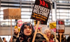 Stop the hate protest in London, UK - 18 Dec 2023<br>Mandatory Credit: Photo by Hesther Ng/SOPA Images/Shutterstock (14263624a) A woman holds a placard to support refugees in the UK during the protest outside the Home Office in London. People gathered at the Home Office in London to protest against the racism and the Rwanda deportation plan of refugees by the UK Government on the UK International Migrants Day. Stop the hate protest in London, UK - 18 Dec 2023