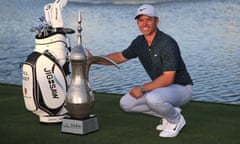 Paul Casey poses with the trophy after his four-shot victory in the Dubai Desert Classic, the 15th European Tour victory of his career.