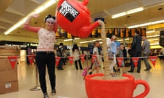 Giant red teapot and cup, in  artwork called Yorkshire Tea Party, at Leeds rail station, on Yorkshire Day 2014