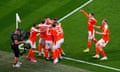 Blackpool’s Kenny Dougall is surrounded by his teammates after putting his side into the lead at Wembley