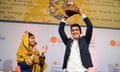 Mohamad Al Jounde holds up the International Children’s Peace Prize, given to him by Malala Yousafzai (left).