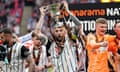 Notts County captain Kyle Cameron celebrates with the trophy as Notts County seal their return to the Football League. 