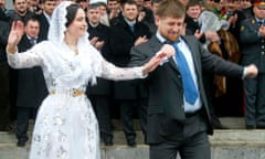 Chechnya’s President Kadyrov dances during a show at Grozny airfield<br>Chechnya’s President Ramzan Kadyrov (R) dances during a show at Grozny airfield March 8, 2007, to celebrate the arrival of the first flight from Moscow. Russia’s troubled Chechnya reopened its civilian airport on Thursday in a move intended to show that the war-ravaged region is recovering under its pro-Moscow government. REUTERS/Said Tsarnayev (RUSSIA) - RTR1N8MB