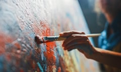 Woman's hand with brush painting on canvas