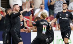 Wayne Rooney celebrates his goal with his DC United teammates