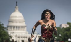 This image released by Warner Bros. Pictures shows Gal Gadot as Wonder Woman in a scene from “Wonder Woman 1984.” The film isn’t skipping theaters or moving to 2021, but it is altering course. The last big blockbuster holdout of 2020 is still opening in U.S. theaters on Christmas Day but it will also be made available to HBO Max subscribers free of charge for its first month, Warner Bros. said Wednesday, Nov. 18, 2020. (Clay Enos/Warner Bros Pictures via AP)