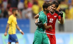 Jubilant Iraq players after their draw with Brazil.