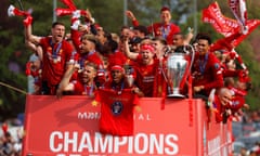 Daniel Sturridge and his Liverpool teammates show off the European Cup on a parade through the city.