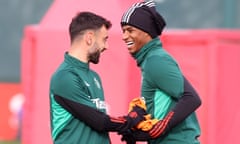 Marcus Rashford shares a joke with Bruno Fernandes in training.