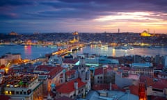 Istanbul at twilight with the Bosphorus flowing through its centre.
