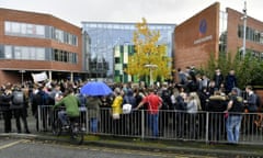 A large crowd of people outside Richard Rose Central Academy