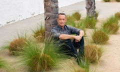 Tom Hanks sitting by a palm tree