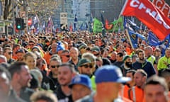 Building and construction workers march during a rally in Melbourne, Tuesday, June 20, 2017. The CFMEU is rallying against the federal government’s reintroduction of the Australian Building and Construction Commission, changes to the Building Code, possible cuts to penalty rates and attacks on workers’ rights. (AAP Image/Joe Castro) NO ARCHIVING