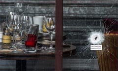 A bullet hole in the window of Le Carillon bistro in Paris