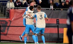 Philadelphia Union forward Chris Donovan (25) is congratulated after his goal against the New England Revolution during the second half of an MLS playoff soccer game, Wednesday, Oct. 8, 2023, in Foxborough, Mass. (AP Photo/Charles Krupa)